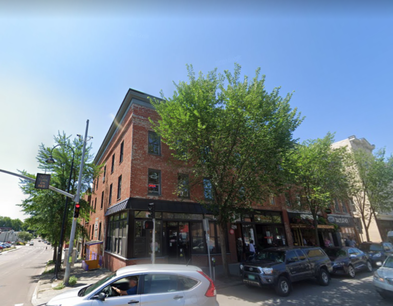 Exterior view of 215 College Street, Burlington Vermont, that has 2 open office spaces for tent.