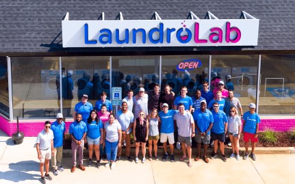 Employees of Laundrolab stand in front of their new storefront at 570 Shelburne Road that was leased by Donahue & Associates