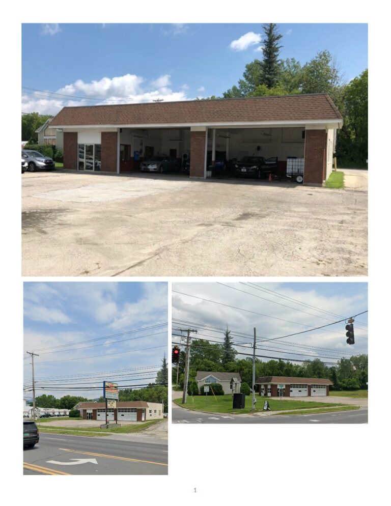 Exterior image of a commercial property for lease at 67 Route 7 South, Rutland Town, VT. This property is a garage that sits on the corner lot at the light.